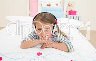 Cute little gril listening to music