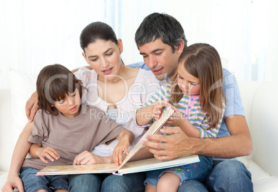 Attentive parents reading with their children