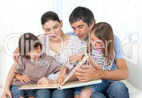 Attentive parents reading with their children