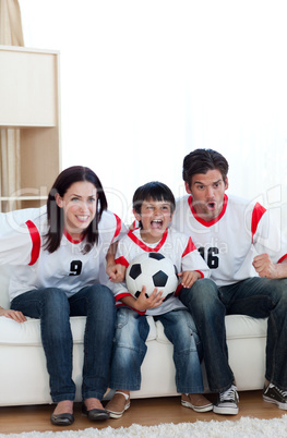 Animated family watching a football match