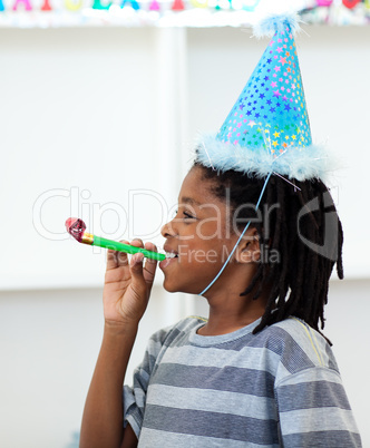 Jolly boy having fun at a birthday party