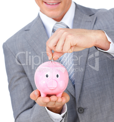 businessman saving money in a piggybank