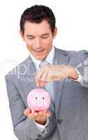 businessman saving money in a piggybank