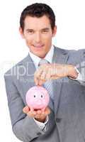 businessman saving money in a piggybank