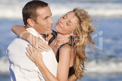 Man and Woman Couple In Romantic Embrace On A Beach