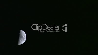 HD Half moon in the dark sky, timelapse