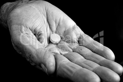 Old hand with pill