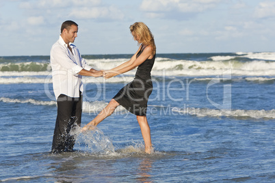 Man and Woman Couple Having Fun Dancing On A Beach