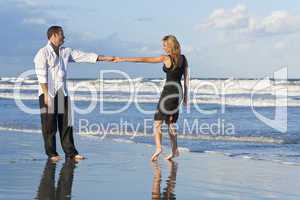 Man and Woman Couple Having Fun Dancing On A Beach