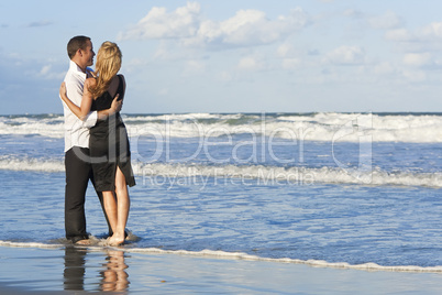 Man and Woman Couple Having Fun Embracing On A Beach