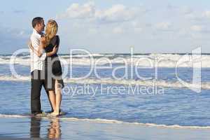 Man and Woman Couple Having Fun Embracing On A Beach