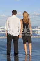 Man and Woman Couple Holding Hands On A Beach