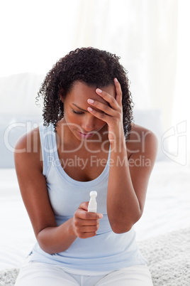 Upset woman finding out results of a pregnancy test