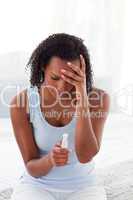 Upset woman finding out results of a pregnancy test