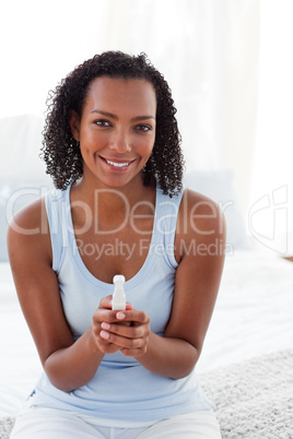 Smiling woman finding out results of a pregnancy test
