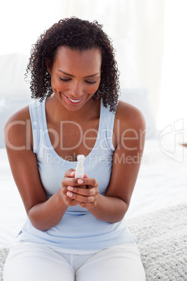 Excited woman finding out results of a pregnancy test