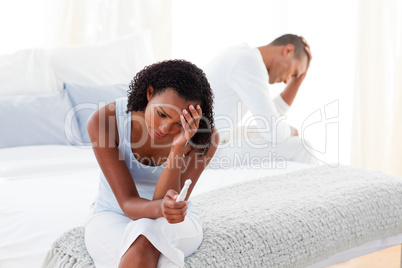 Upset couple finding out results of a pregnancy test
