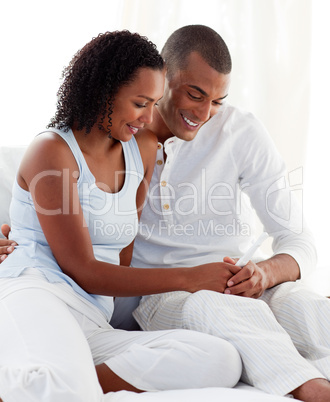 Afro-american couple finding out results of a pregnancy test