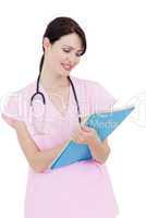Serious young nurse taking notes
