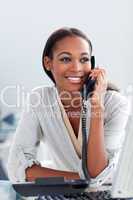 Bright Afro-american businesswoman talking on a phone