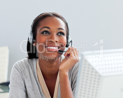 Afro-american businesswoman using headset
