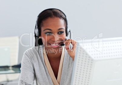 Assertive ethnic customer service agent with headset on