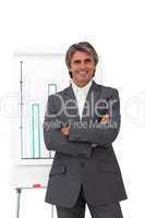 Charismatic mature businessman with folded arms