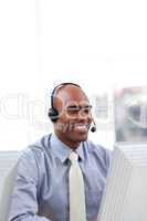 Ethnic businessman with headset on