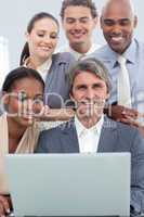 Positive International business people using a laptop