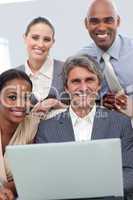 Confident Multi-ethnic business team working at a laptop