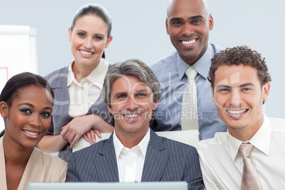 Charismatic International business people using a laptop