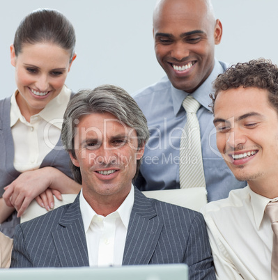 International business team working at a laptop