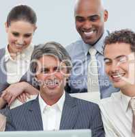 International business team working at a laptop