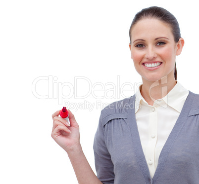 Smiling attractive businesswoman holding a marker