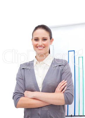 Confident young businesswoman with folded arms