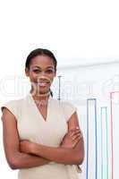 Smiling ethnic businesswoman with folded arms
