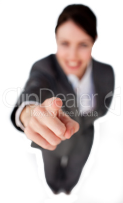 Businesswoman pointing at the camera against a white background