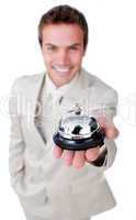 Attractive businessman showing a service bell