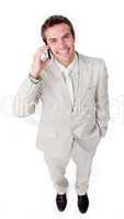 Positive businessman using a mobile phone