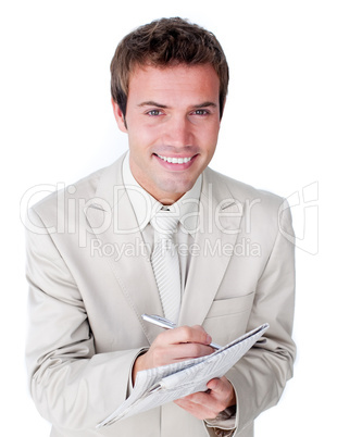 Smiling caucasian businessman holding a newspaper