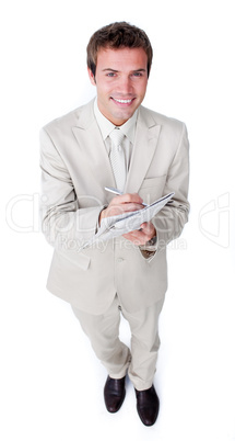 Charismatic young businessman holding a newspaper