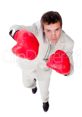 Competitive businessman using boxing gloves