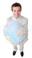 Positive businessman showing a terrestrial globe