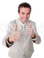 Cheerful young businessman with thumbs up