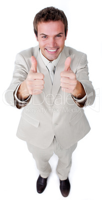 Victorious businessman with thumbs up