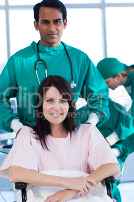 surgeon with patient on a wheelchair