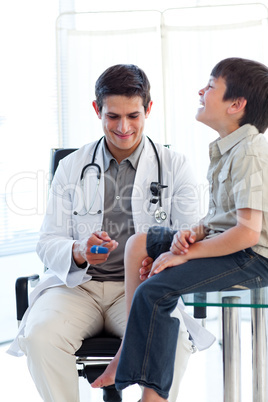 Confident male doctor checking a patient's reflex