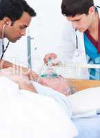 A doctor putting oxygen mask on a senior patient