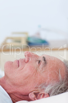 Senior patient lying on a hospital bed