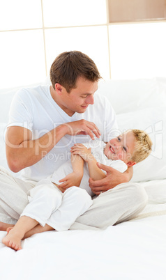 Animated dad and his little boy playing on a bed